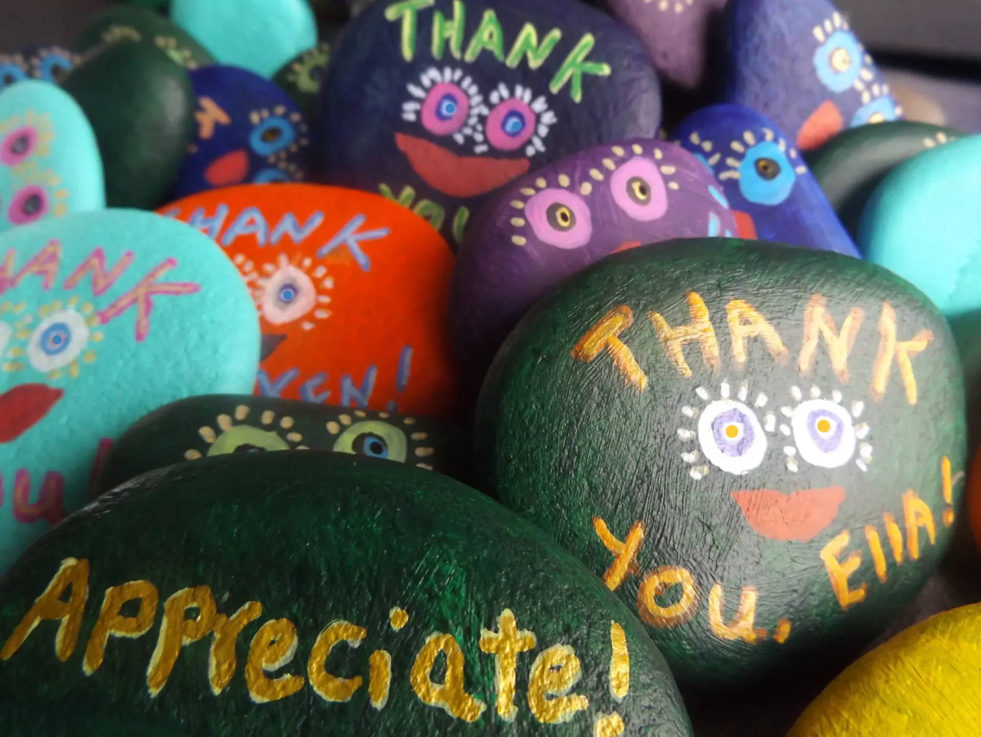 Hand-painted rocks with THANK YOU and Appreciate! messages